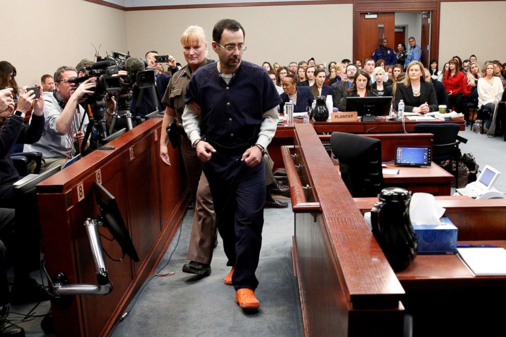 PHOTO: Larry Nassar, a former team USA Gymnastics doctor who pleaded guilty in Nov. 2017 to sexual assault charges, is escorted into the courtroom during his sentencing hearing in Lansing, Mich., Jan. 24, 2018.