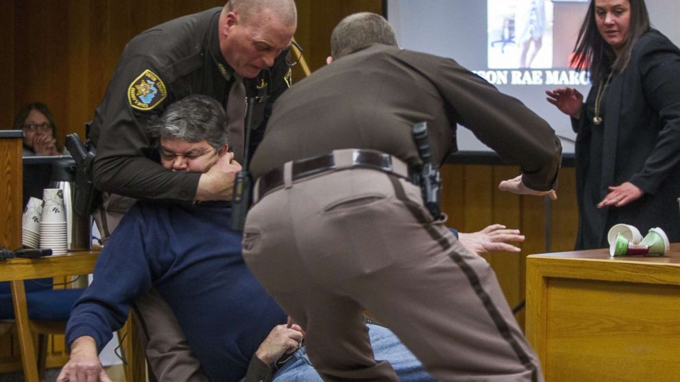 PHOTO: Eaton County Sheriff's deputies restrain Randall Margraves, father of three victims of Larry Nassar, Feb. 2, 2018, in Eaton County Circuit Court in Charlotte, Mich.