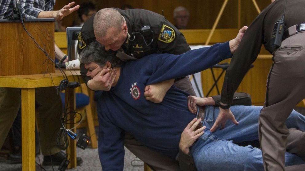 PHOTO: Eaton County Sheriff's deputies restrain Randall Margraves, father of three victims of Larry Nassar, Feb. 2, 2018, in Eaton County Circuit Court in Charlotte, Mich.