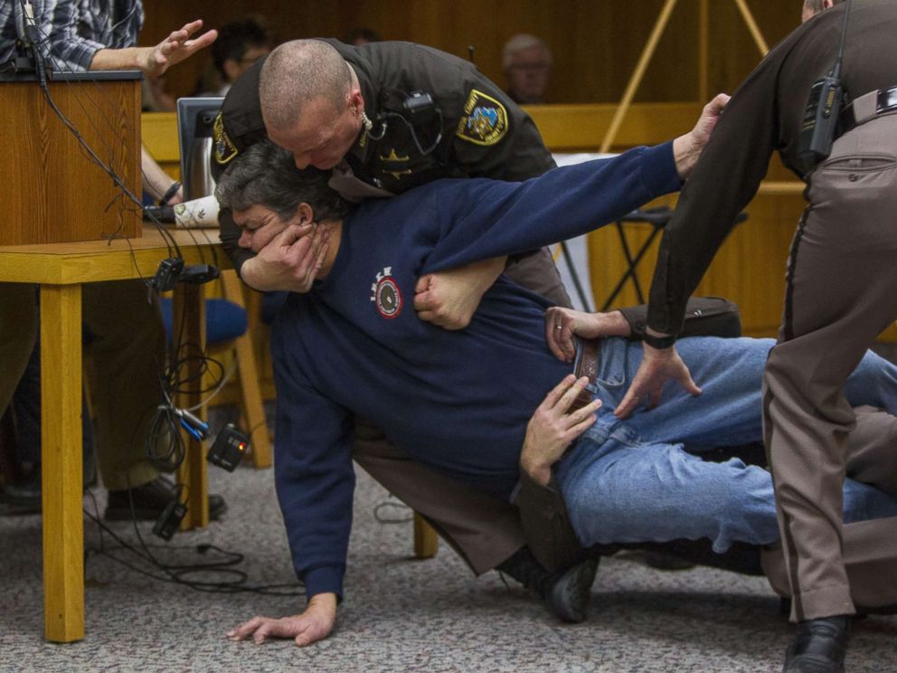 PHOTO: Eaton County Sheriff's deputies restrain Randall Margraves, father of three victims of Larry Nassar, Feb. 2, 2018, in Eaton County Circuit Court in Charlotte, Mich.