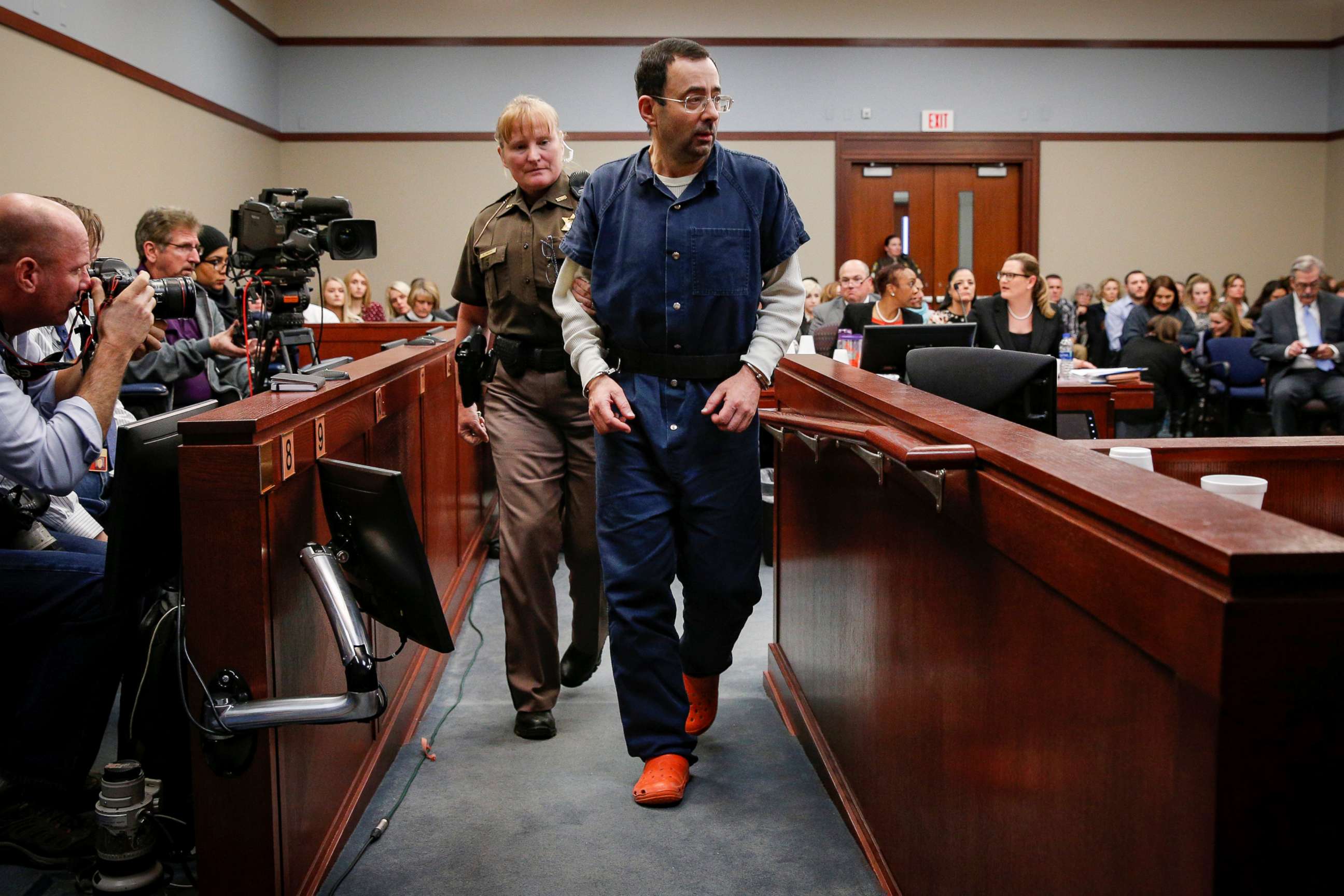 PHOTO: Larry Nassar, a former team USA Gymnastics doctor who pleaded guilty in November 2017 to sexual assault charges, is escorted by a court officer during his sentencing hearing in Lansing, Mich., Jan. 17, 2018.
