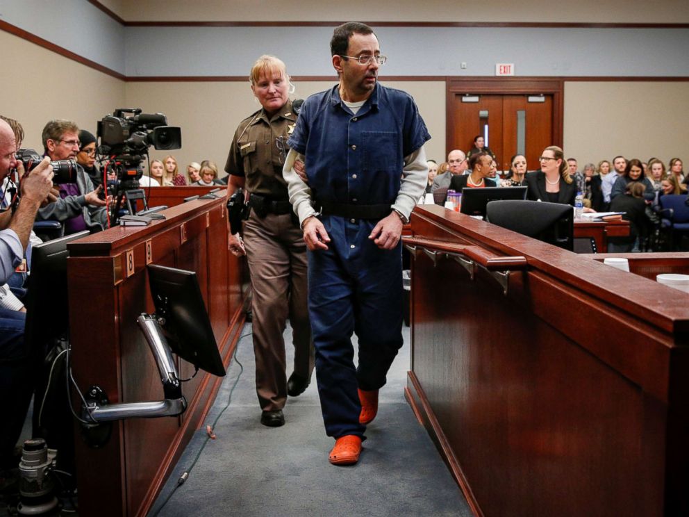 PHOTO: Larry Nassar, a former team USA Gymnastics doctor who pleaded guilty in November 2017 to sexual assault charges, is escorted by a court officer during his sentencing hearing in Lansing, Mich., Jan. 17, 2018.