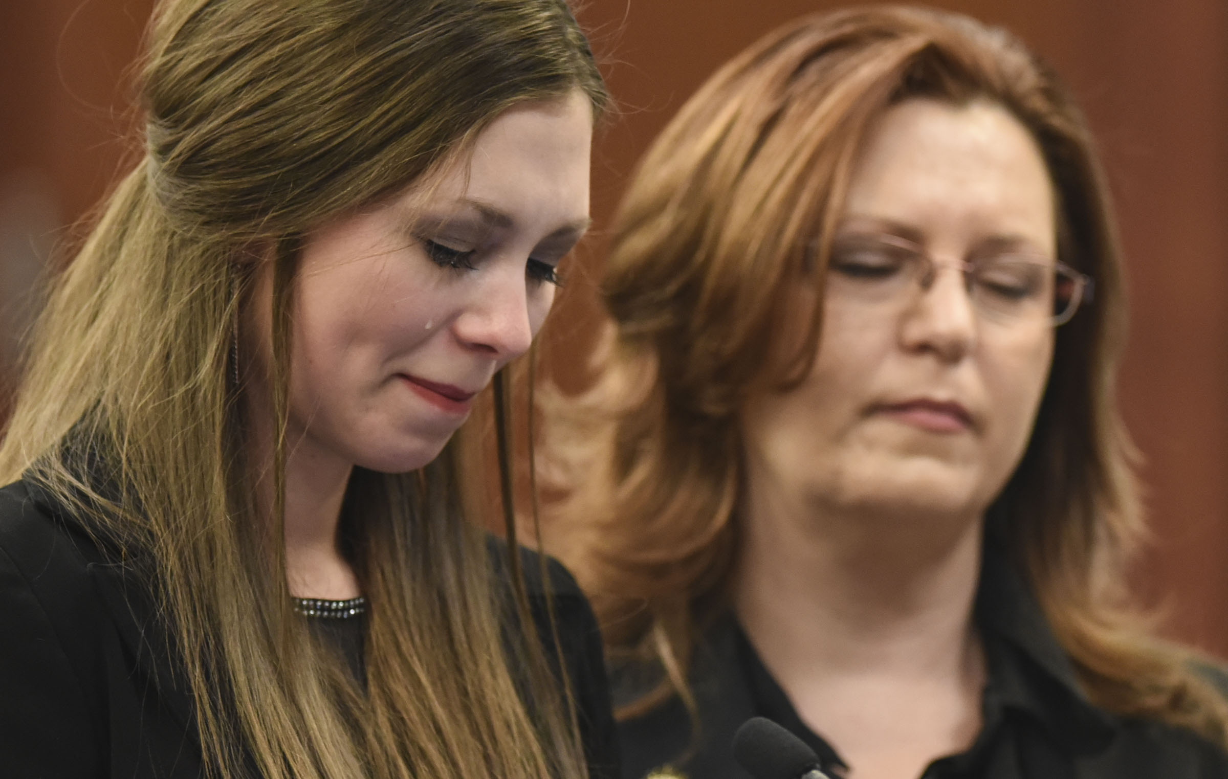 Dancer Jessica Smith and her mother Kimberly listen as Circuit Judge Rosemarie Aquilina speaks during the third day of victim impact statements in the trial of doctor Larry Nassar, in Lansing, Mich., Jan. 18, 2018.