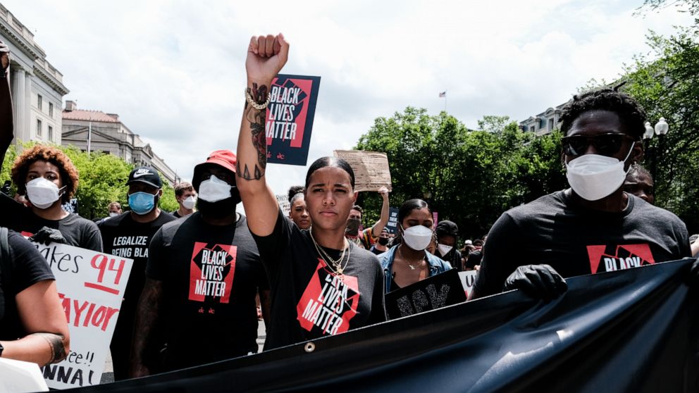 PHOTO: Natasha Cloud marches to the MLK Memorial to support Black Lives Matter and marking the end of slavery in the U.S., on June 19, 2020, in Washington.