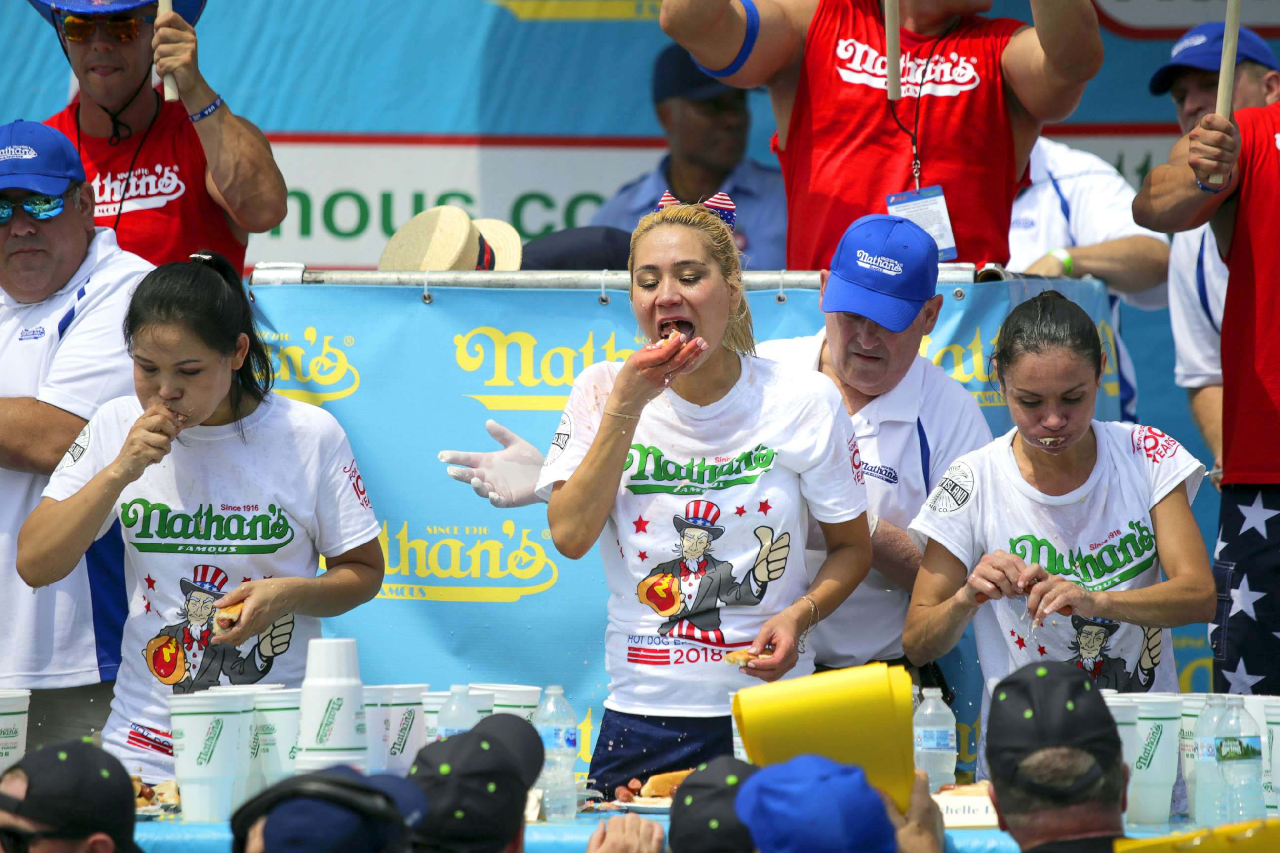PHOTO: Winner Miki Sudo (C) competes in the women's annual Nathan's Hot Dog Eating Contest on July 4, 2018 in Coney Island.