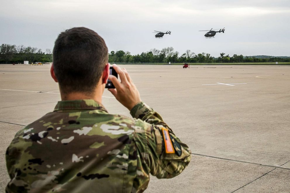 PHOTO: Texas National Guard helicopters traveling to the Texas-Mexico border fly off, April 6, 2018, in Austin, Texas.