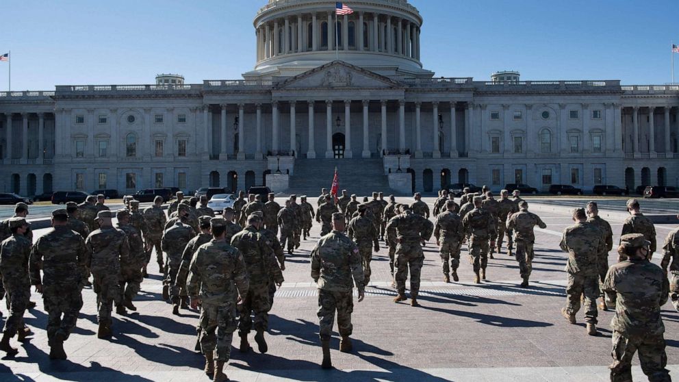 PHOTO: Members of the National Guard are seen on the east front of the U.S. Capitol building on Capitol Hill in Washington, D.C., on March 2, 2021.