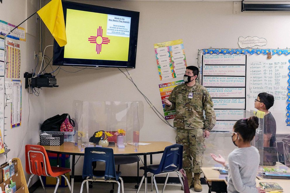PHOTO: FILE - National Guard soldier Mario Meraz recites the "Salute to the New Mexico Flag" with students during a third grade class at Highland Elementary School in Las Cruces, New Mexico, March 4, 2022.