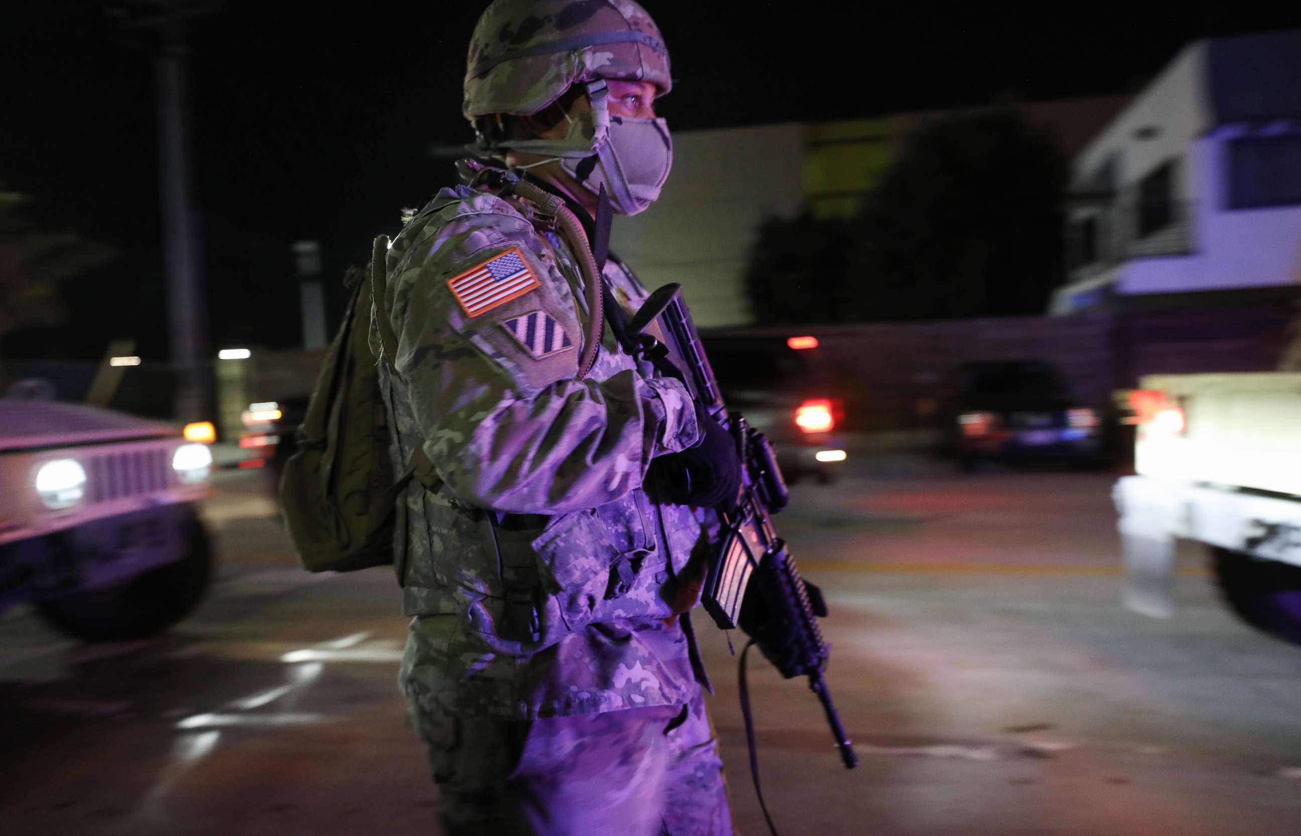 PHOTO: A U.S. National Guard soldier walks on patrol in the aftermath of George Floyds death after looting occurred in the area amid demonstrations, May 31, 2020, in Santa Monica, California.