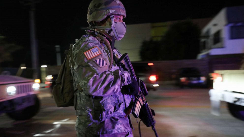 PHOTO: A U.S. National Guard soldier walks on patrol in the aftermath of George Floyds death after looting occurred in the area amid demonstrations, May 31, 2020, in Santa Monica, California.