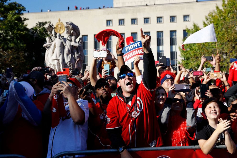 PHOTO: Washington Nationals fans cheer during a parade to celebrate the team's World Series baseball championship over the Houston Astros, Saturday, Nov. 2, 2019, in Washington.
