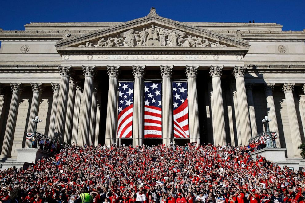 PHOTO: Fans gather on the steps of the National Archives during a parade to celebrate the Washington Nationals' World Series baseball championship over the Houston Astros, Saturday, Nov. 2, 2019, in Washington.