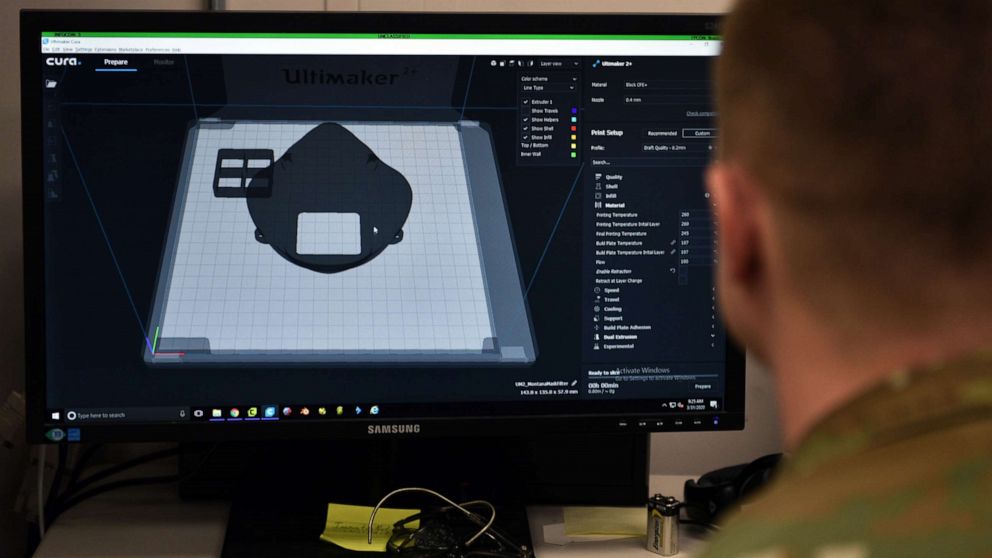 PHOTO: Tech. Sgt. Tracy Gibbs prepares a 3D printed N95 face mask to be printed through modeling software at the Louis F Garland Department of Defense Fire Academy on Goodfellow Air Force Base, Texas, March 31, 2020.