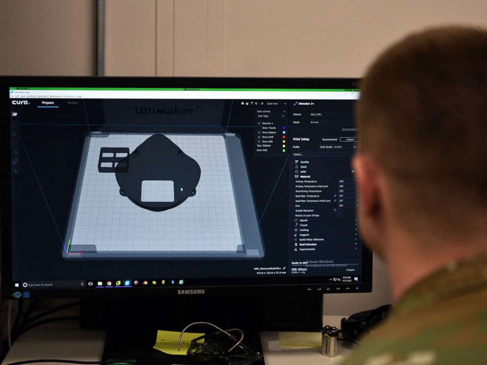 PHOTO: Tech. Sgt. Tracy Gibbs prepares a 3D printed N95 face mask to be printed through modeling software at the Louis F Garland Department of Defense Fire Academy on Goodfellow Air Force Base, Texas, March 31, 2020.