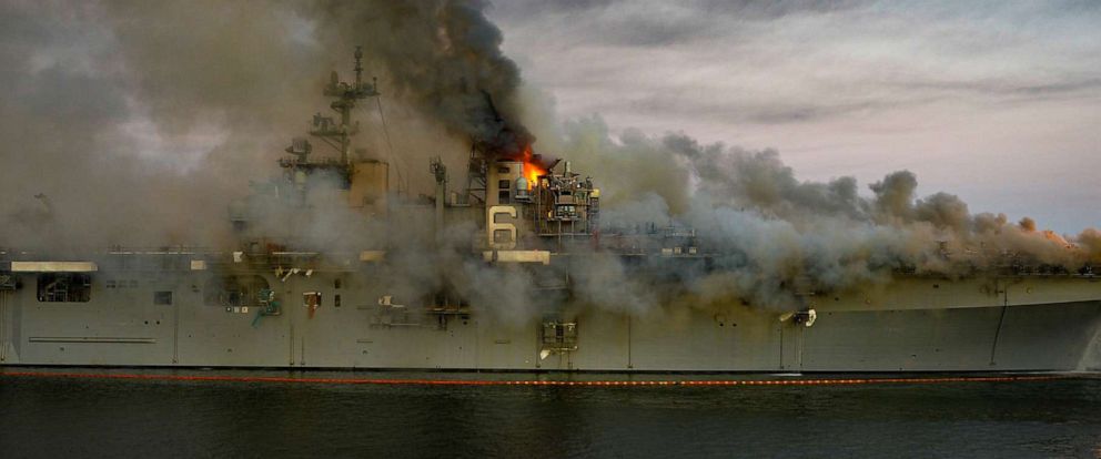 PHOTO: Boats combat a fire on board the U.S. Navy amphibious assault ship USS Bonhomme Richard at Naval Base San Diego, July 12, 2020.