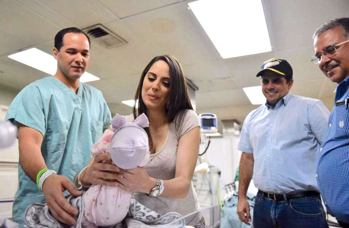 PHOTO: Tania Rodriguiz Ramos holds her newborn baby, shortly after giving birth aboard the USNS Comfort on Saturday. 