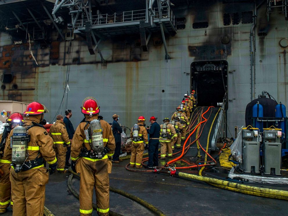 PHOTO: Sailors prepare to board the amphibious assault ship USS Bonhomme Richard to fight an ongoing fire at Naval Base in San Diego, Calif. on July 14, 2020. 