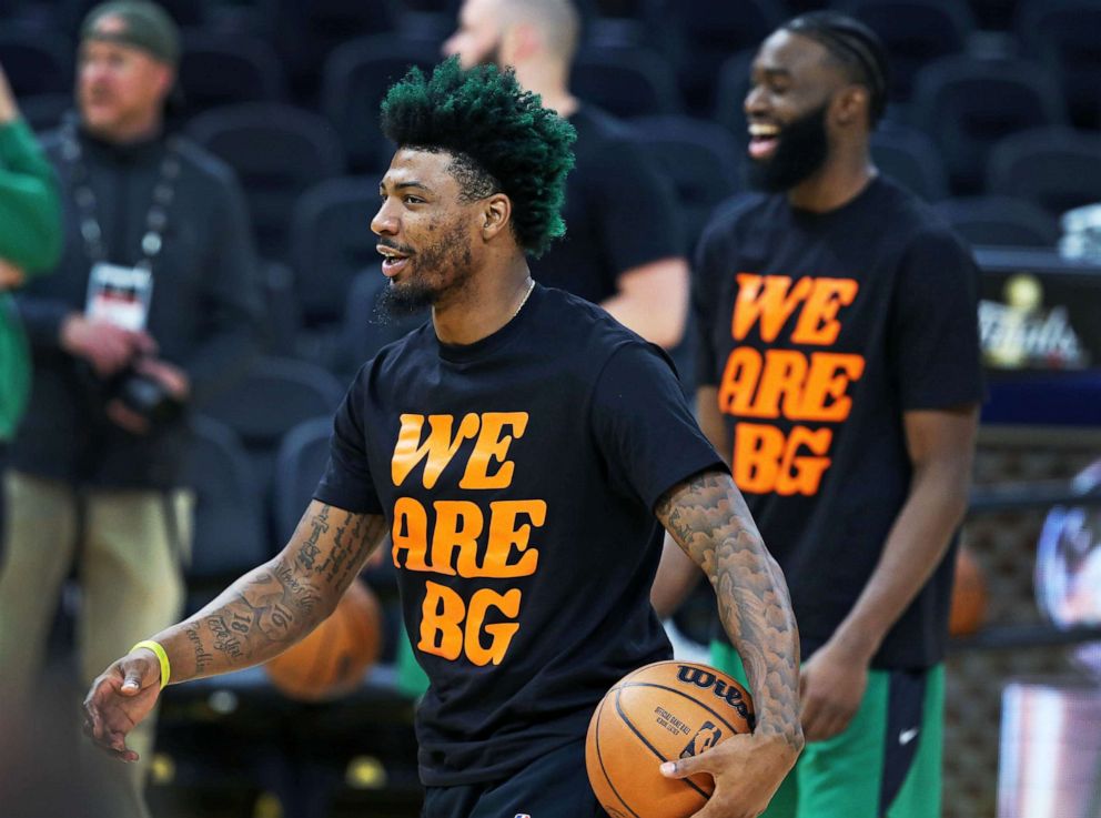 PHOTO: Celtics players Marcus Smart (left) and Jaylen Brown (right) wear shirts in support of Brittney Griner, as they prepare to play the Golden State Warriors for Game 2 of the NBA Finals at the Chase Center in San Francisco, June 4, 2022.