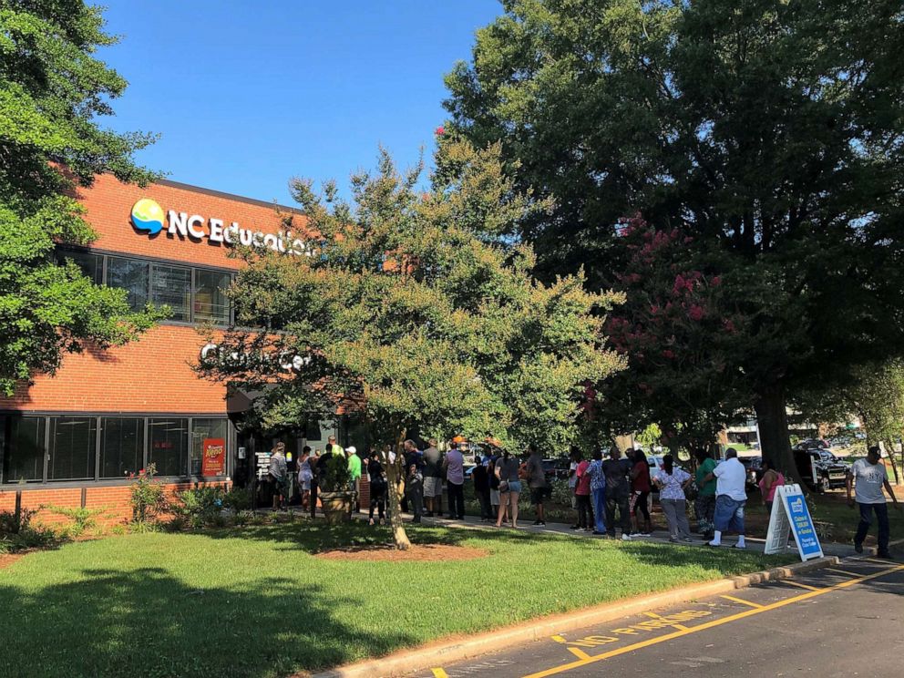 PHOTO: People line up outside the claims center at the headquarters of the N.C. Education Lottery in Raleigh, N.C., June 24, 2019.
