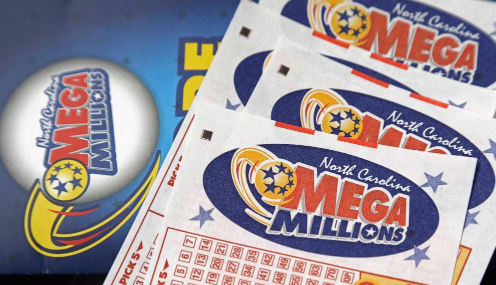 PHOTO: A Mega Millions lottery tickets rest on a counter at a Pilot travel center near Burlington, N.C. 