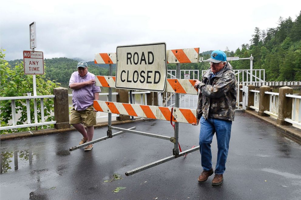 PHOTO: Local residents position a road closed sign at the entrance to the Lake Tahoma Dam, May 30, 2018, in McDowell County, N.C. Continuous rain over the last several days has raised the water level of the dam and forced evacuations of local residents.