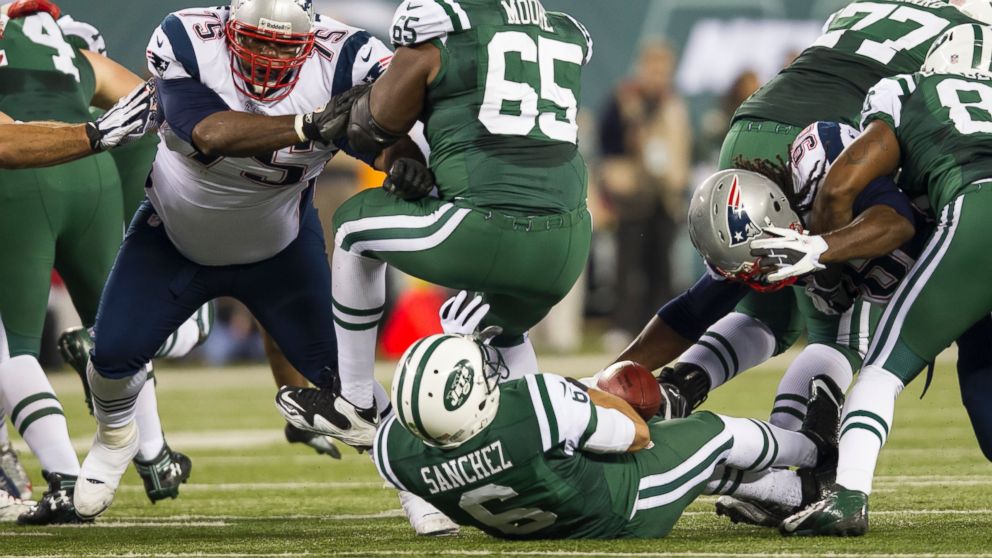 Mark Sanchez  fumbles the ball in this Nov. 22, 2012 file photo taken during the NFL Thanksgiving Day game between the New England Patriots and the New York Jets at MetLife Stadium in East Rutherford, New Jersey. 