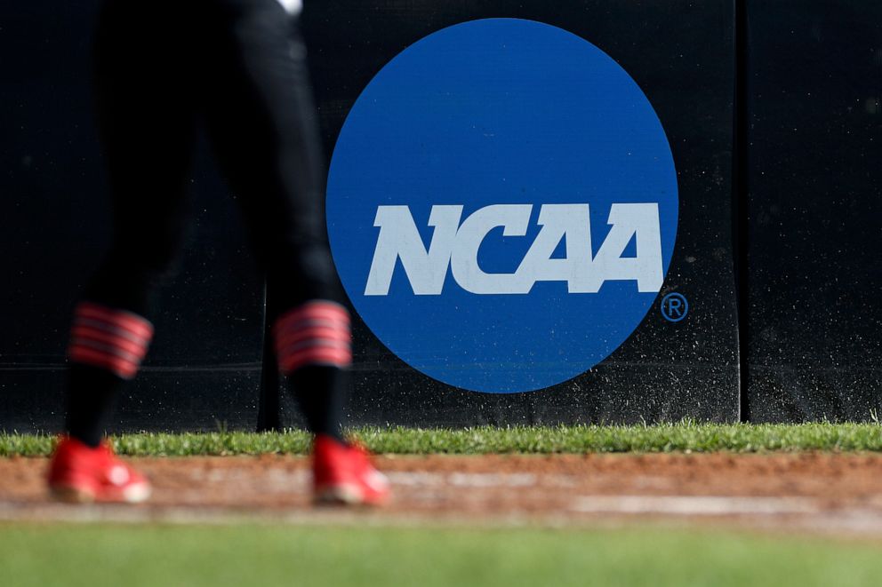 PHOTO: An athlete stands near an NCAA logo during a softball game in Beaumont, Texas, April 19, 2019.