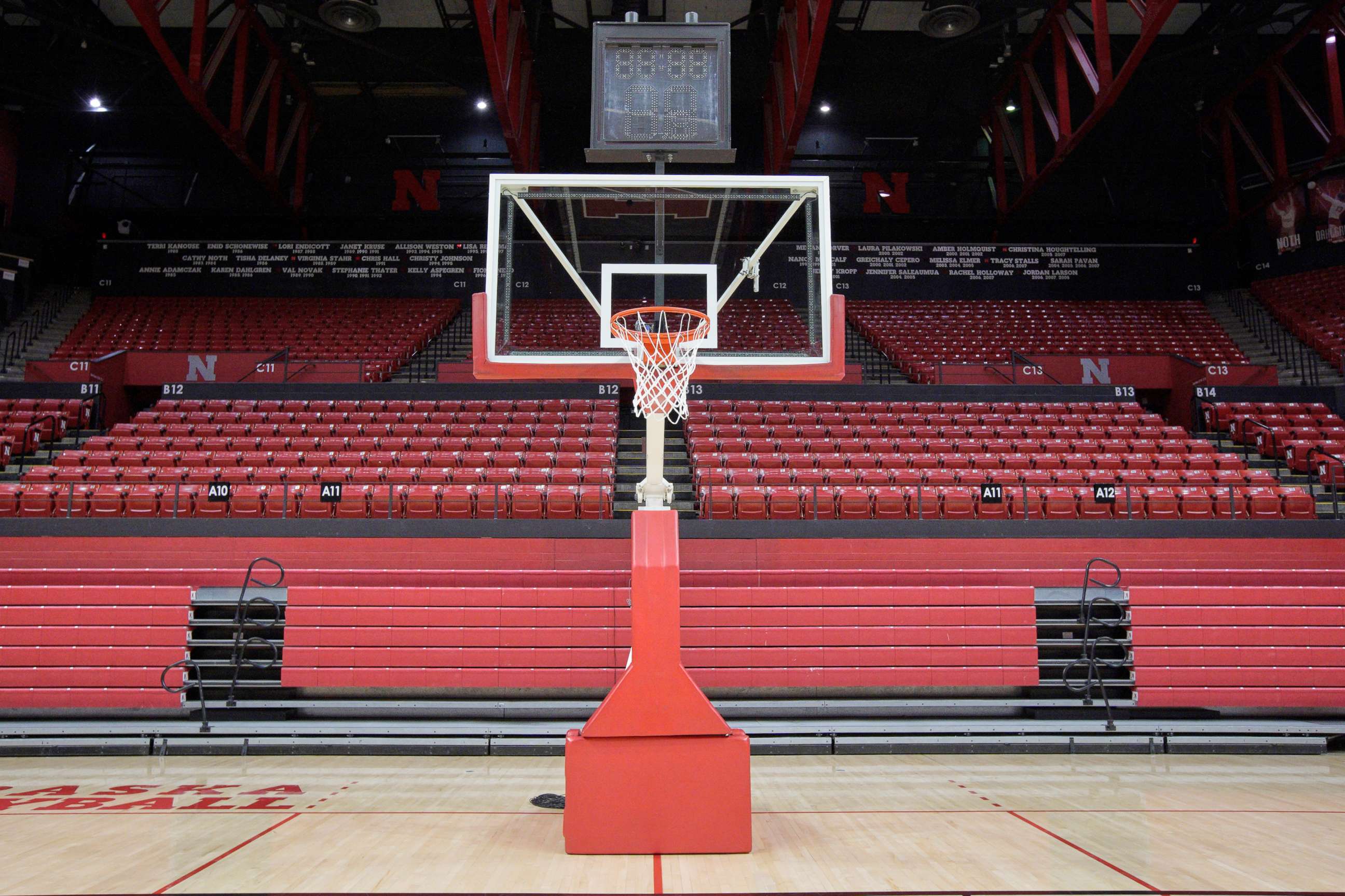 PHOTO: A basket post stands in front of folded bleachers at the Bob Devaney Sports Center, March 11, 2020, ahead of the Nebraska boys basketball tournament in Lincoln, Neb.