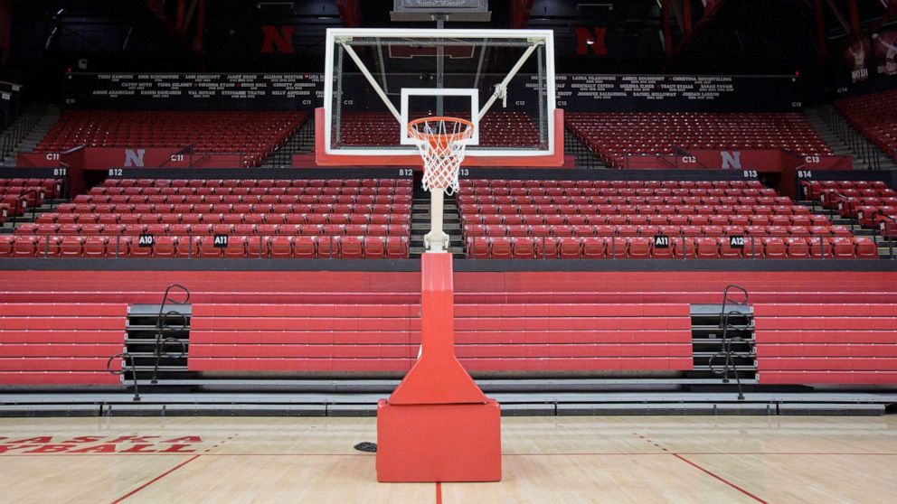 PHOTO: A basket post stands in front of folded bleachers at the Bob Devaney Sports Center, March 11, 2020, ahead of the Nebraska boys basketball tournament in Lincoln, Neb.