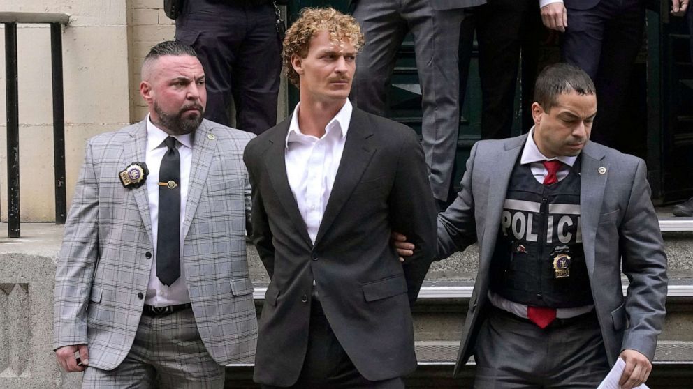 PHOTO: Daniel Penny, center, is walked out of the New York Police Department 5th Precinct in Lower Manhattan, May 12, 2023, after he surrendered to authorities after being charged with 2nd Degree Manslaughter in the chokehold death of Jordan Neely.