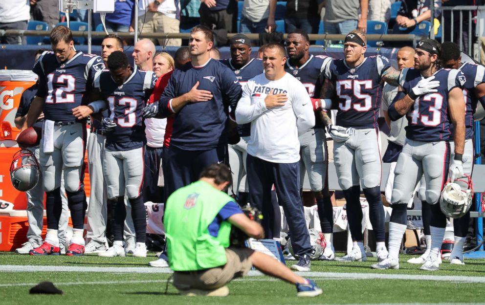 PHOTO: Patriots players during the national anthem before the start of a game against the Houston Texans at Gillette Stadium in Foxborough, Mass., Sept. 24, 2017.