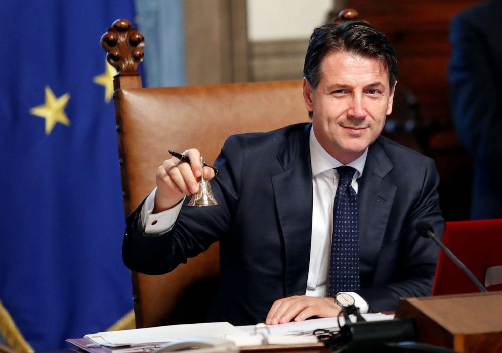 PHOTO: Newly appointed Italian Prime Minister Giuseppe Conte rings the bell during his first cabinet meeting at Chigi palace in Rome, June 1, 2018.