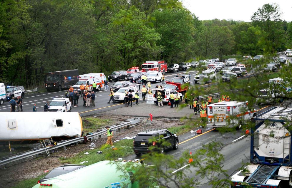 PHOTO: Emergency personnel work at the scene of a school bus and dump truck collision on Interstate 80 in Mount Olive, N.J., May 17, 2018.