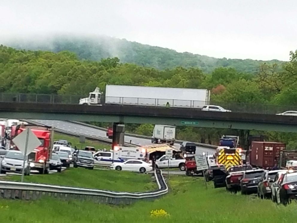 PHOTO: Vehicles stop at the scene where a school bus collided with a dump truck near Mount Olive Township, N.J, May 17, 2018.