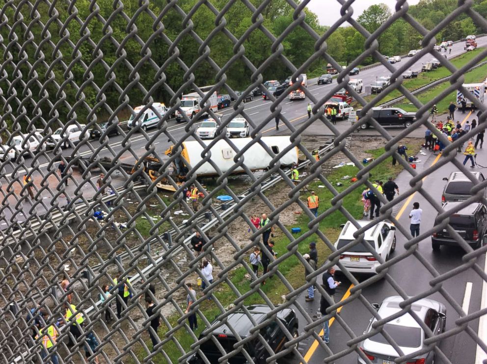 PHOTO: Vehicles stop at the scene where a school bus collided with a dump truck near Mount Olive Township, N.J., May 17, 2018.