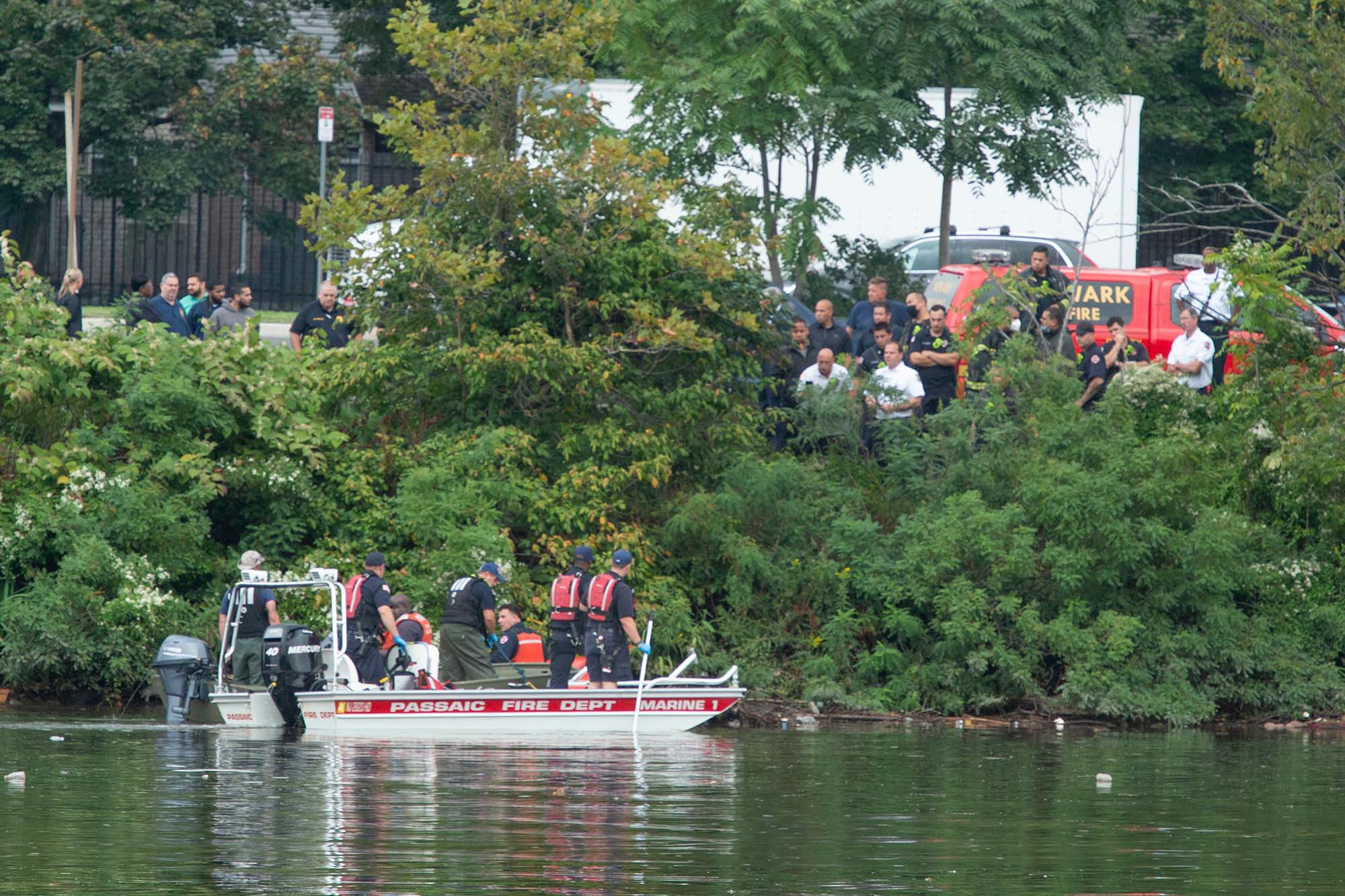 PHOTO: Emergency personnel remove a body from the Passaic River near the Newark and Kearny, N.J. border, Sept. 9, 2021.
