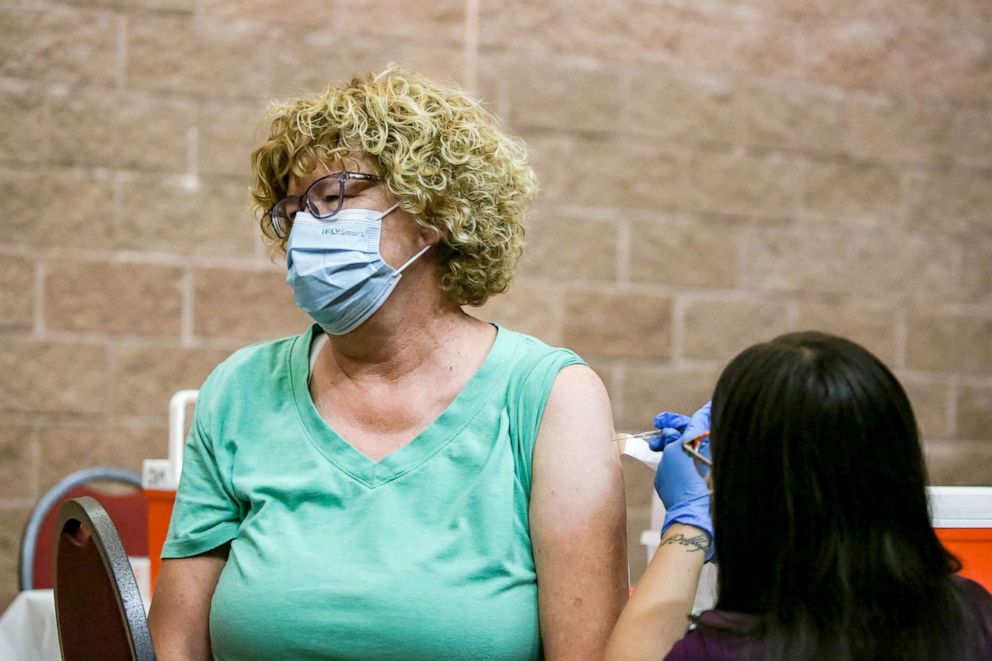 PHOTO: Chris Ashpy receives a vaccine at a clinic offering COVID-19 vaccinations at the New Mexico Farm & Ranch Heritage Museum in Las Cruces, N.M., Oct. 19, 2021.