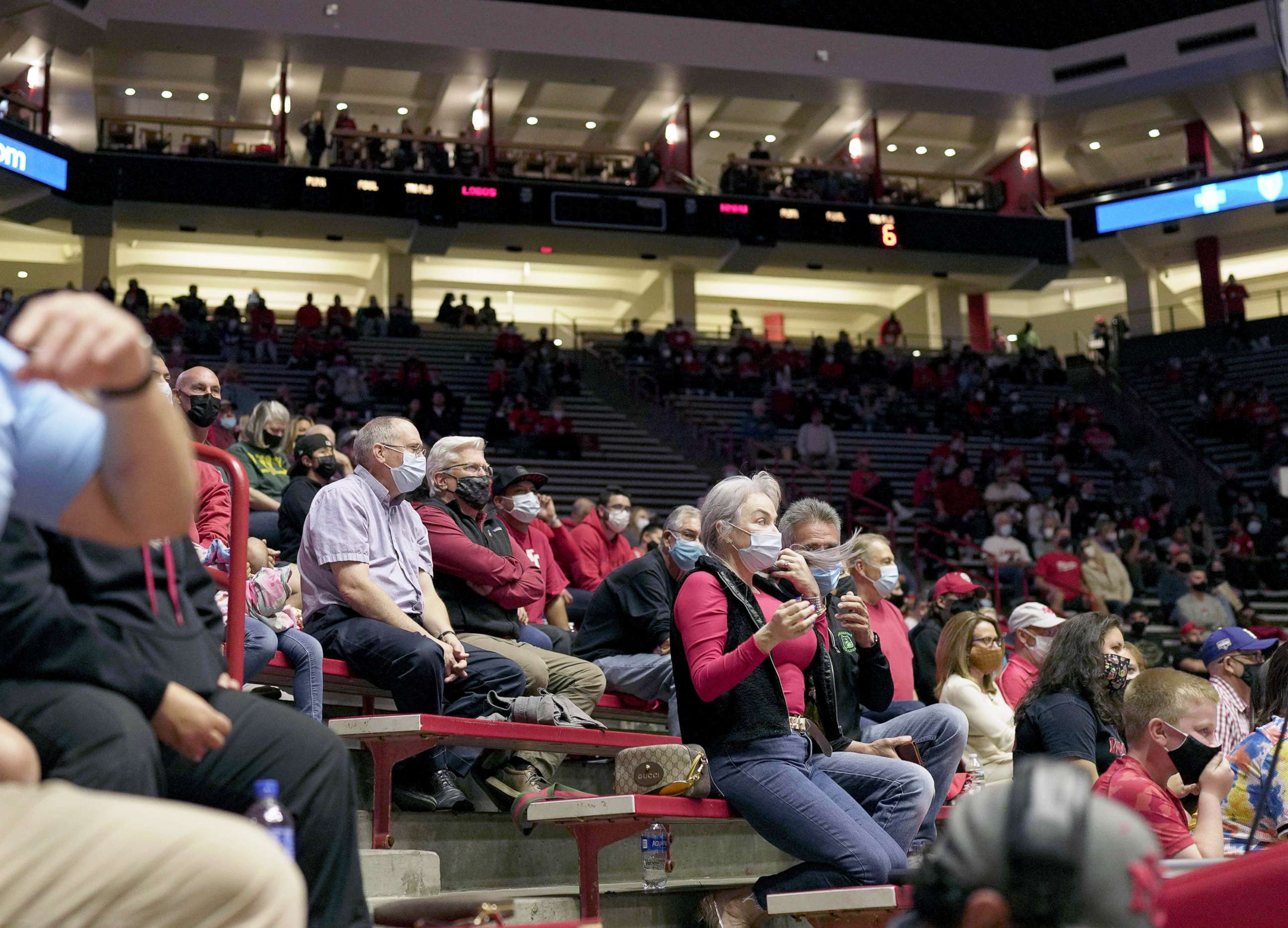PHOTO: A crowd wearing Covid-19 protective masks attends the first Lobo men's basketball game of the season against New Mexico Highlands in Albuquerque, N.M., Nov. 5, 2021.