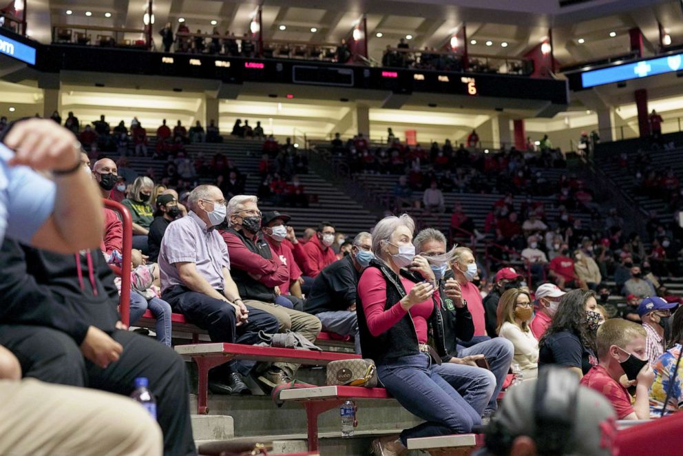 PHOTO: A crowd wearing Covid-19 protective masks attends the first Lobo men's basketball game of the season against New Mexico Highlands in Albuquerque, N.M., Nov. 5, 2021.