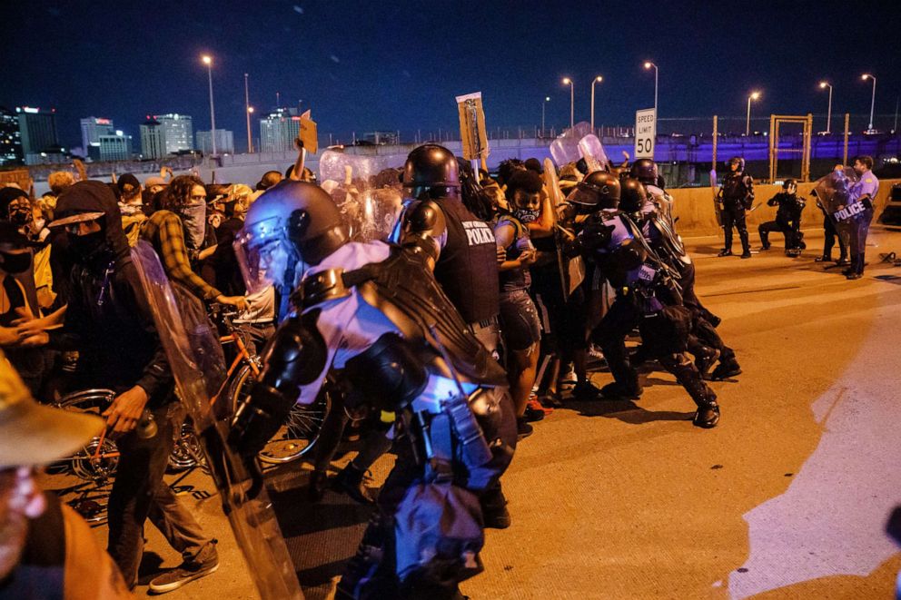 PHOTO: Protesters clash with police after a tear-gas canister was lobbed into the crowd gathered on Highway 90 in New Orleans to protest the death of George Floyd, June 3, 2020.