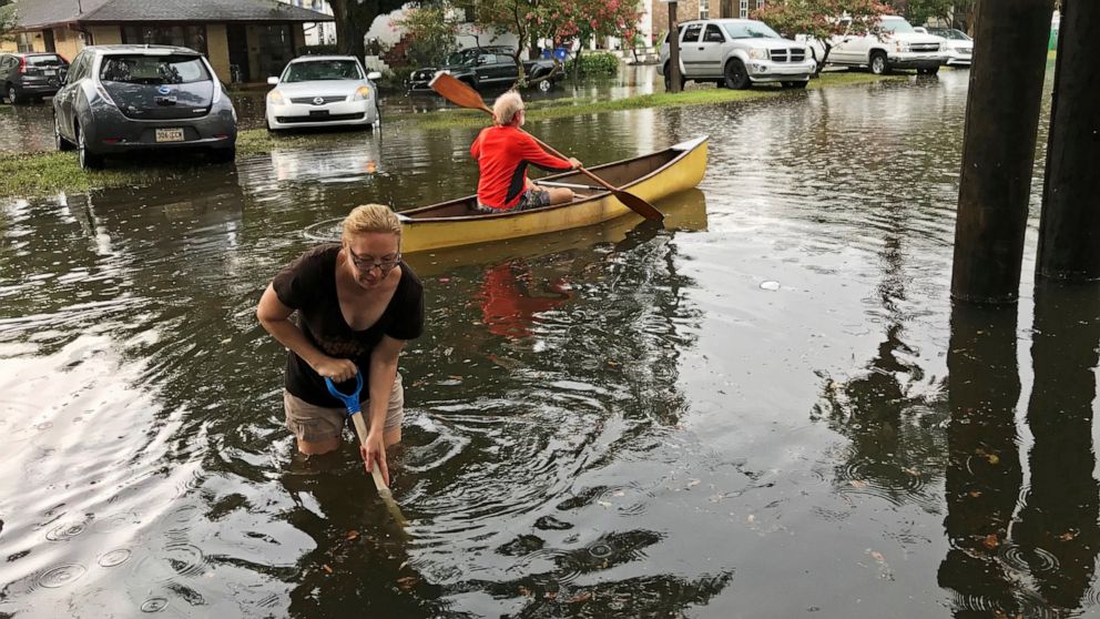 PHOTO: People cope with the aftermath of severe weather in the Broadmoor neighborhood in New Orleans, Wednesday, July 10, 2019.