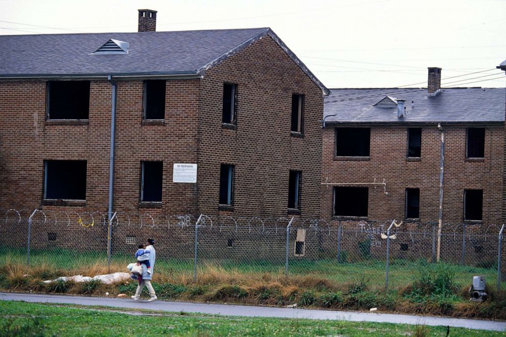 PHOTO: The deserted Desire Public Housing Project in a poor section of New Orleans is surrounded by a barbed wire fence.