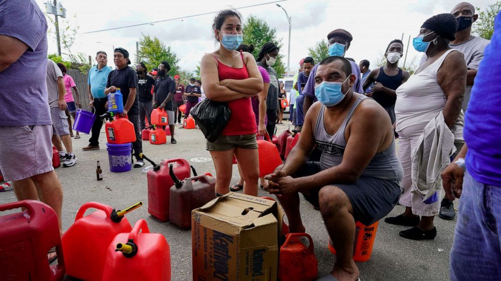 PHOTO: In the aftermath of Hurricane Ida, people wait in line for gas, Aug. 31, 2021, in New Orleans, La.