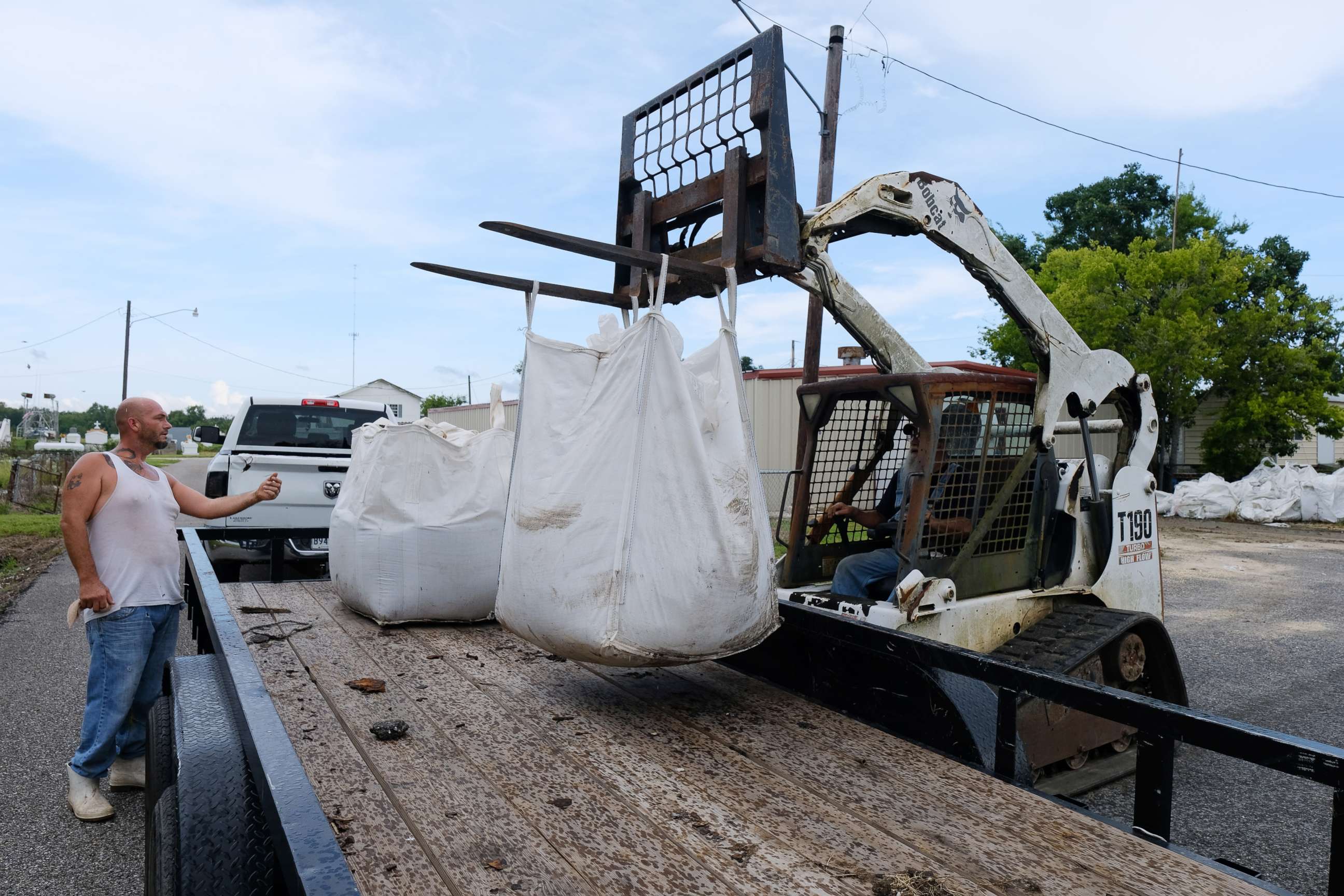 PHOTO: Kerry Warren works to get sand bags ready for flood prevention ahead of a tropical system in Lafitte, La., July 11, 2019.