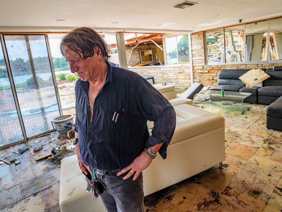 PHOTO: Eric Ehlenberger pauses as he goes through his damaged home in New Orleans on July 10, 2019, following a storm that swamped the city and paralyzed traffic.
