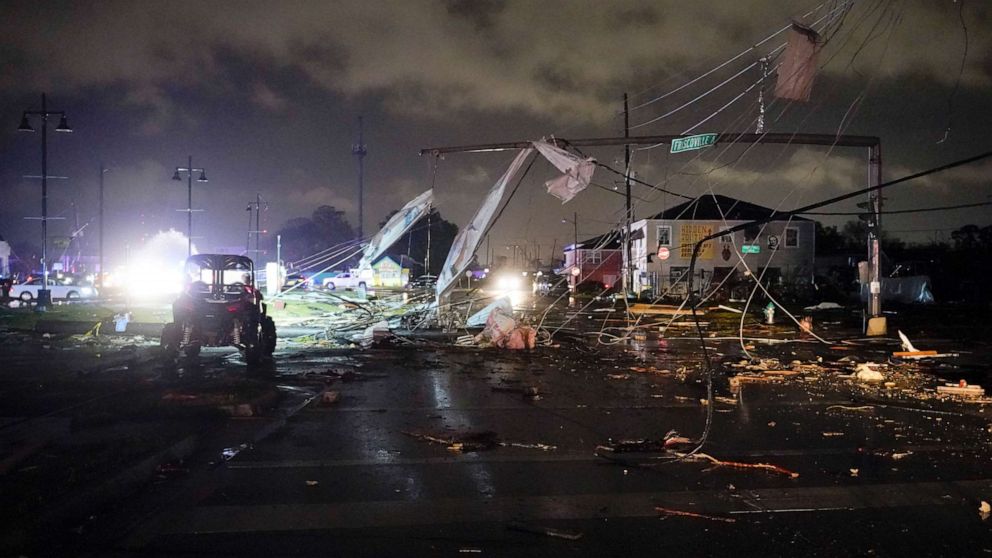 PHOTO: A debris lined street is seen in the Lower 9th Ward, Tuesday, March 22, 2022, in New Orleans, after strong storms moved through the area.