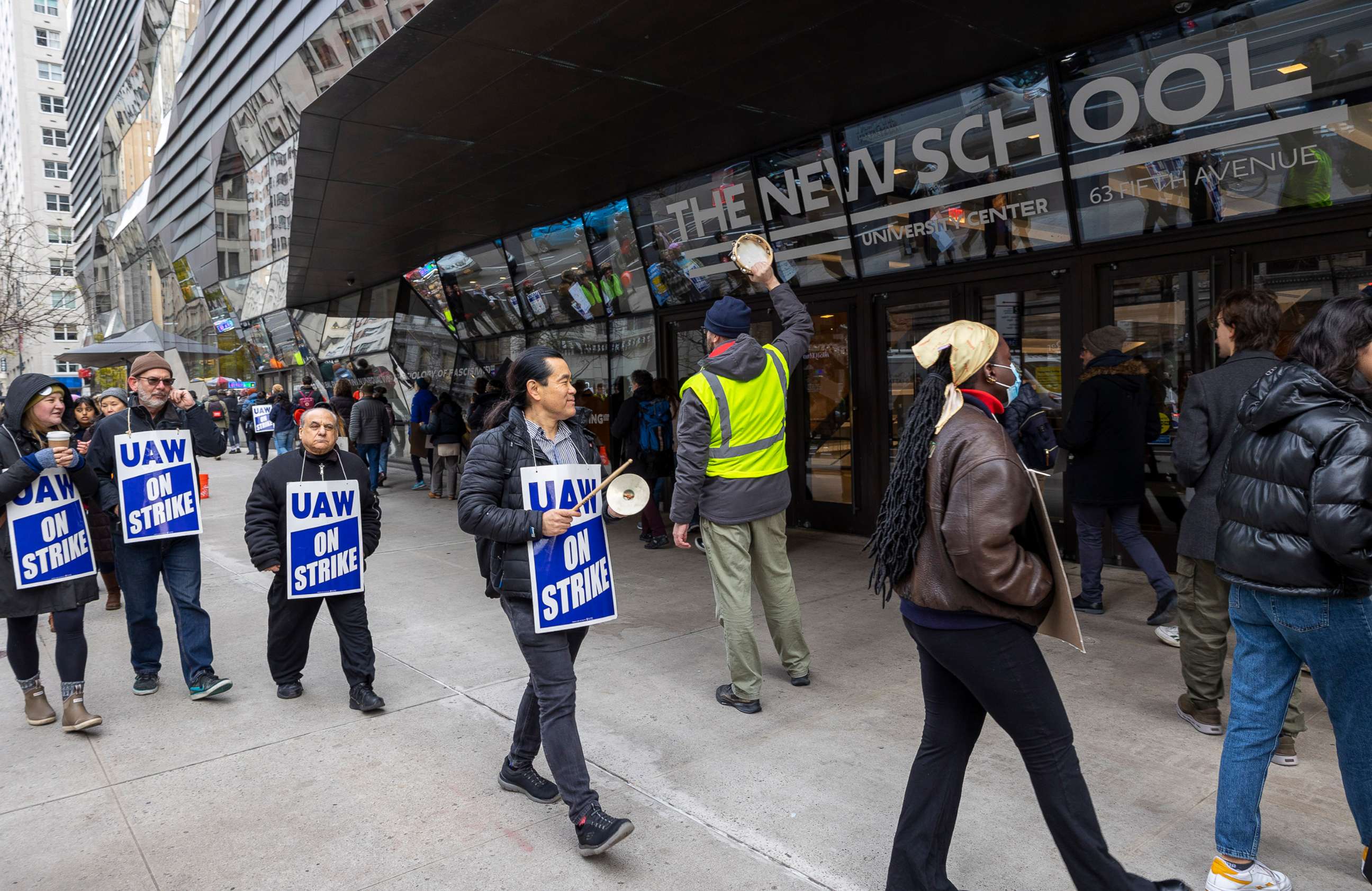 PHOTO: Strikers wear signs that read ''UAW On Strike'' on a picket line outside of the New School as part-time faculty continue to strike for job security and wage increases that keep up with the cost of living, on Nov. 29, 2022, in New York.