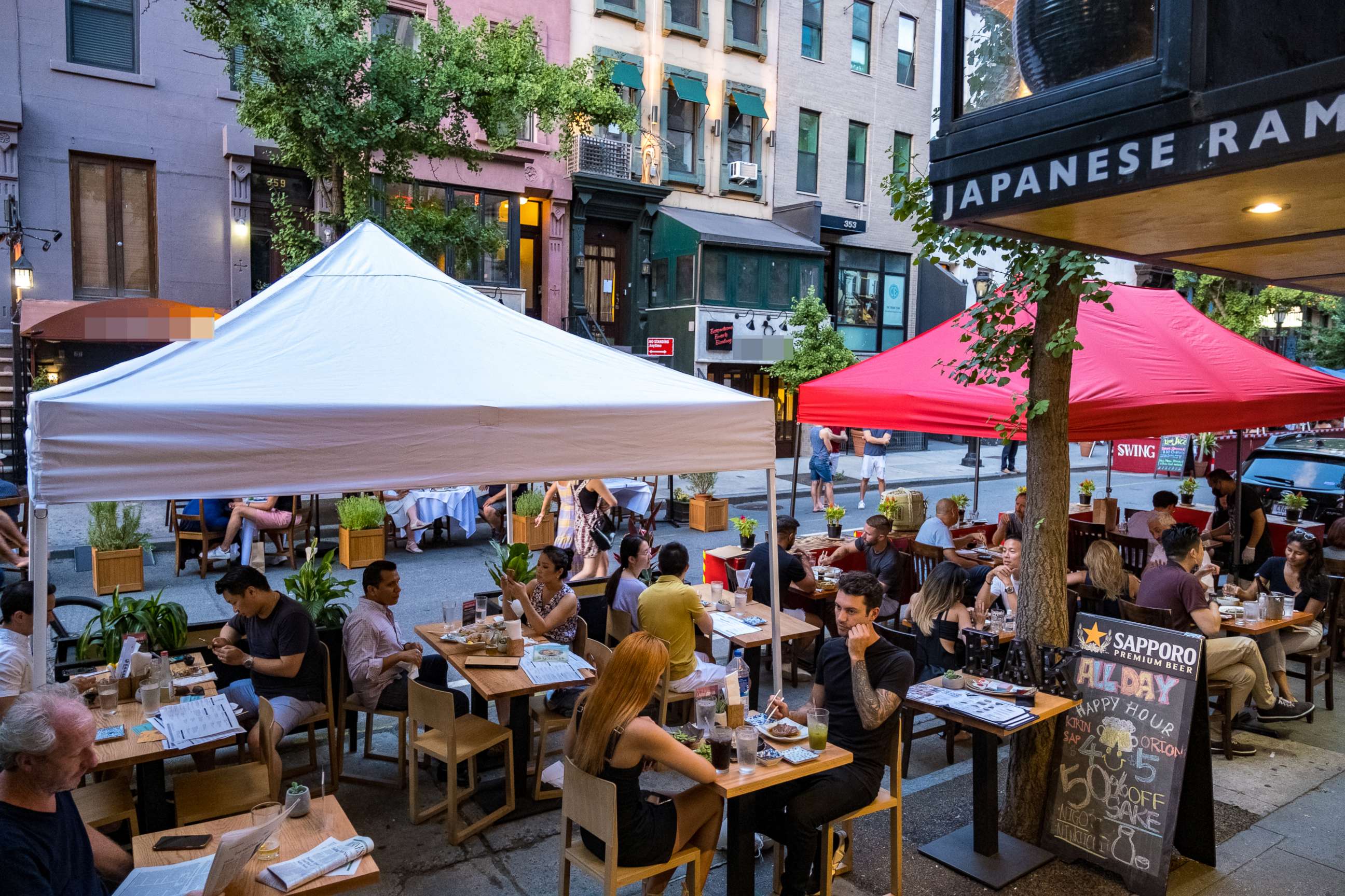 PHOTO: People dine al fresco, or open air, in Hell's Kitchen on July 21, 2020 in New York City.