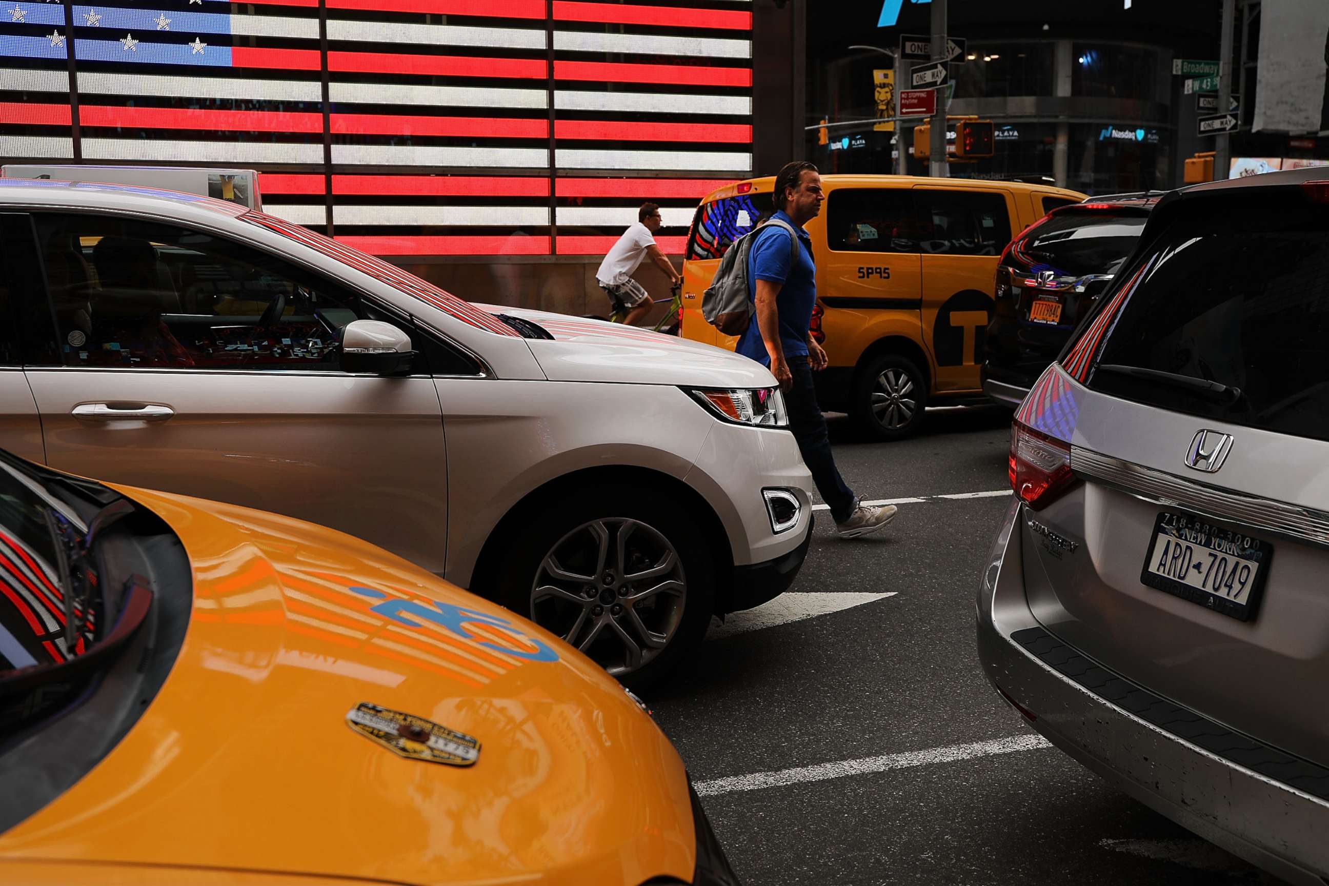 PHOTO: A man walks through traffic in Times Square on July 30, 2018, in New York.