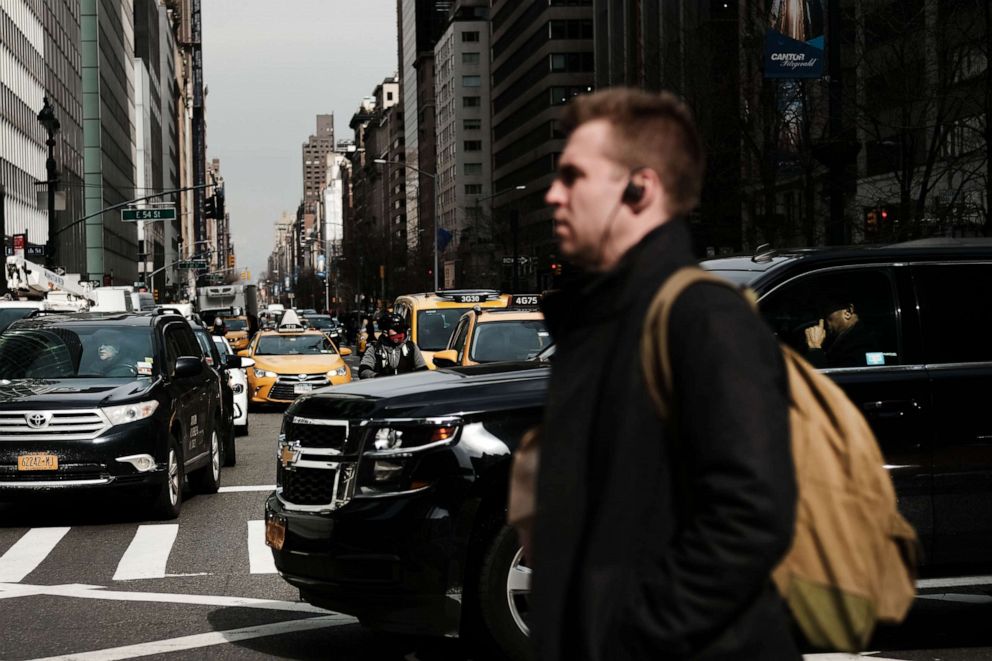 PHOTO: Cars and pedestrians merge on a busy Manhattan street on Feb. 27, 2019, in New York.